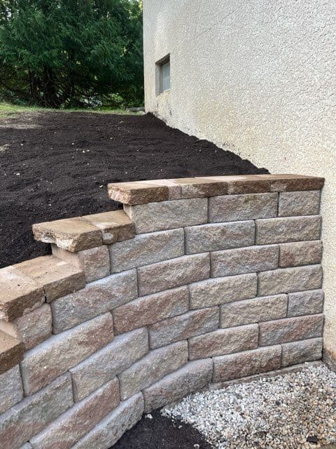 Sturdy Custom Wing Retaining Wall Installed image